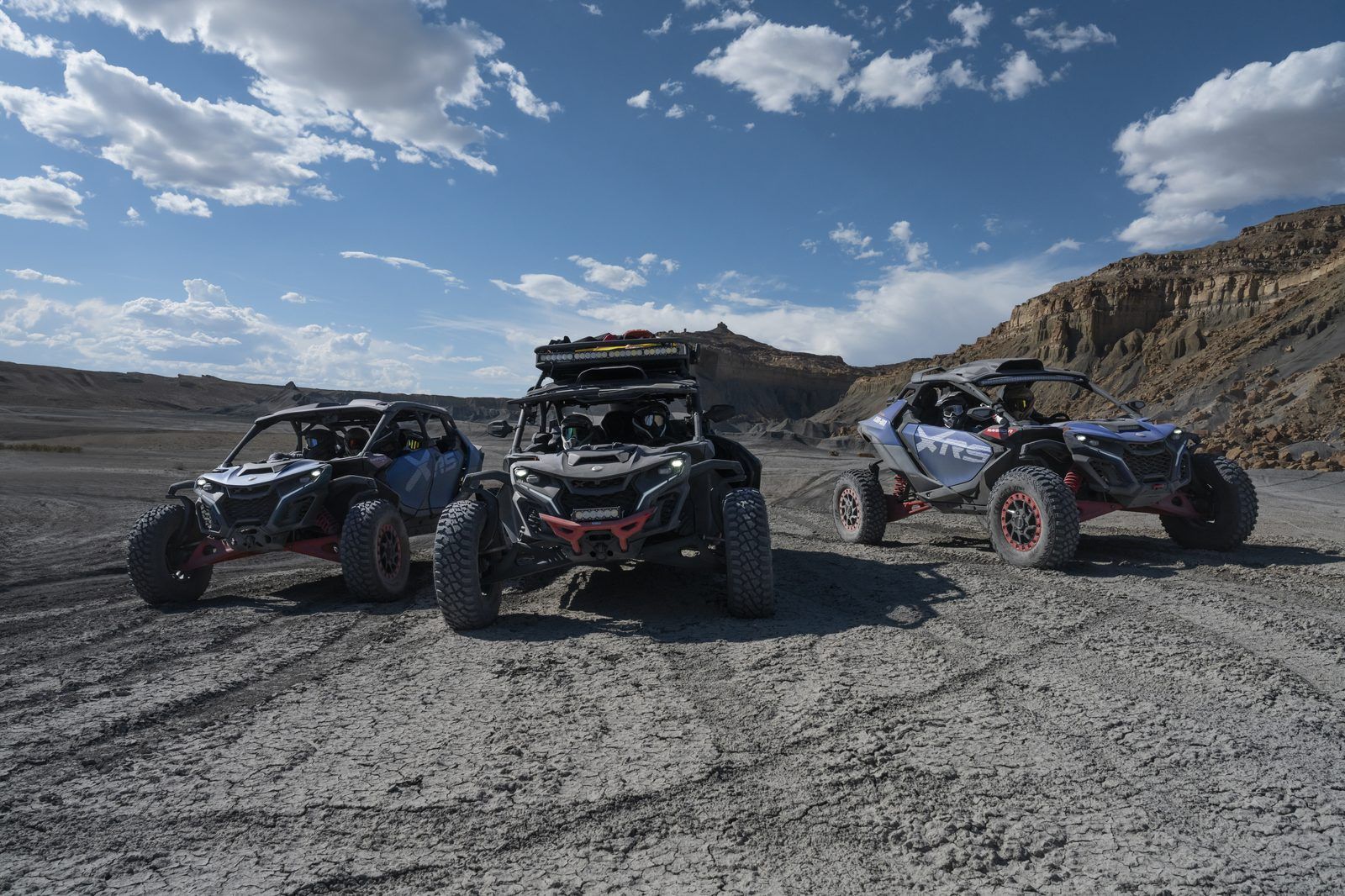 Three brand-new Can-Am Maverick X3 Max UTV rentals lined up in El Paso desert terrain